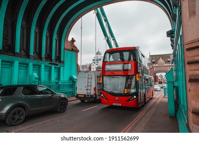 London UK January 2021 Traffic On The Londons Tower Bridge, Red Double Decker Bus Crossign The Bridge On A Cold Sunday During UKs National Covid Lockdown