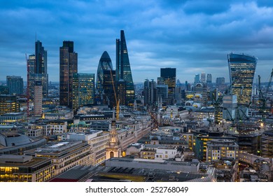 LONDON, UK - JANUARY 27, 2015: Busy streets of City of London, business and banking aria. London's panorama in sun set. View from the St. Paul cathedral