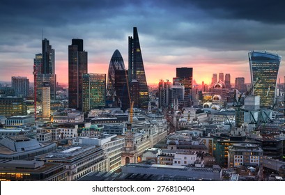 LONDON, UK - JANUARY 27, 2015: City of London, business and banking area. London's panorama in sun set. View from the St. Paul cathedral
