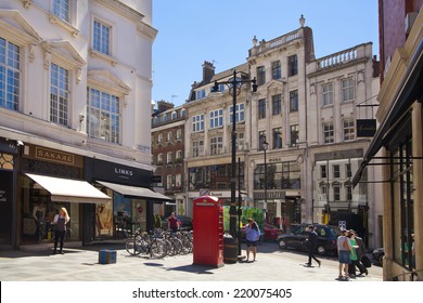 LONDON, UK - JULY 03, 2014: Bond street boutiques, street of famous small fashion businesses