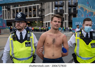 London, UK - July 11 2021: Man Led Away By Police At Wembley Stadium In Handcuffs