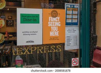 LONDON, UK - JULY 14, 2021: Social Distancing Signage In Restaurant Window 