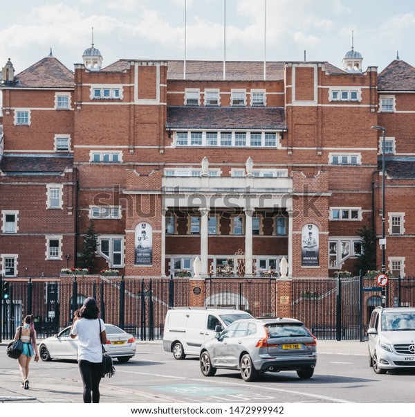 London, UK - July 16, 2019: People and cars outside\
Kennington Oval, an international cricket ground and home ground of\
Surrey County Cricket Club since it was opened in 1845, London,\
UK.