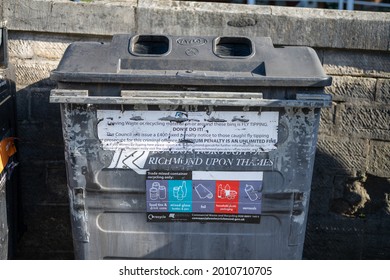 London, UK - July 16 2021: Worn Mixed Recycling Bin In Richmond Upon Thames