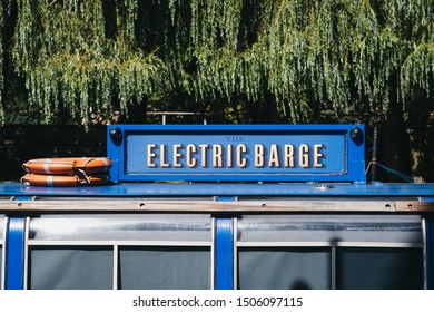 London, UK - July 18, 2019: Close Up View Of A Sign On The Electric Barge, A Unique Venue For Private Hire Or Canal Boat Party In Paddington, London, UK..