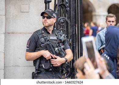 London, UK, July, 2019. A Police Officer With A Machine Gun Wearing Stab And Bullet Proof Vest.