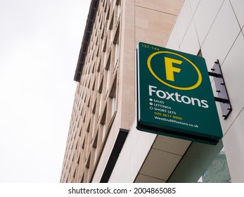 London, UK, July 2021: Foxtons West End Estate Agents, 137-144 High Holborn, London WC1V 6PL. Covering Holborn And Surrounding Areas. The Green And Yellow Logo Sign, Left Side Copy Text Space.