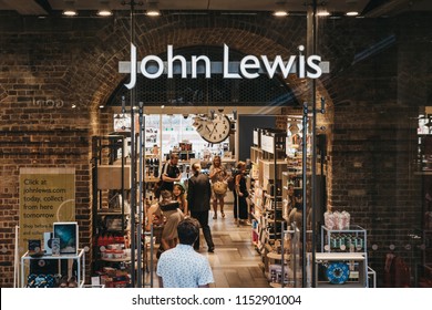 London, UK - July 26, 2018: People entering John Lewis shop inside St. Pancras station, one of the largest railway stations in London and home to Eurostar.