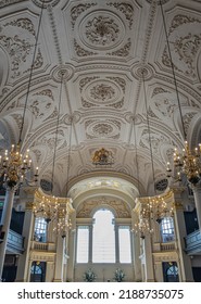 London, UK- July 4, 2022: Trafalgar Square. Inside St. Martin-in-the-fields Church, White Decorated Ceiling Above Nave, Golden Trims And Chandeliers. 