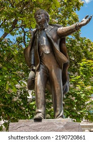 London, UK - July 4, 2022: Parliament Square Gardens. Bronze Statue Of David Lloyd George Closeup Under Green Foliage.