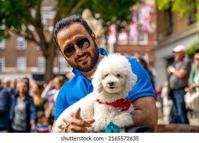 London, UK - July 5 2022: Man With Cute Dog At The Duke Of York, Queens Platinum Jubilee Celebration