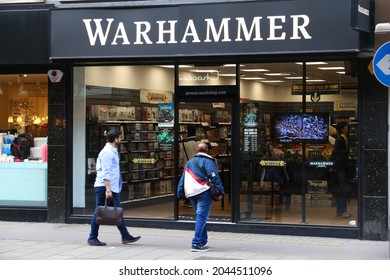 LONDON, UK - JULY 6, 2016: People walk by Games Workshop Warhammer game shop in London. It is located at famous Oxford Street.