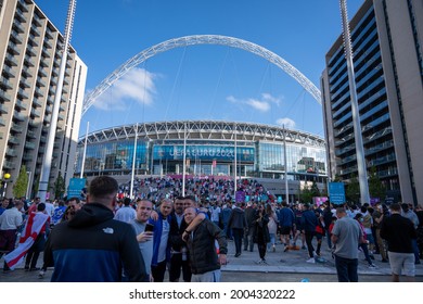 London, UK - July 7 2021: Friends take a photo with Wembley Stadium in the background before the Euro 2020 Semi Final England v Denmark