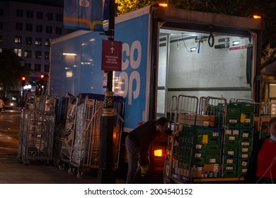 London, UK - July 7 2021: Lorry Driver Unloading Delivery For Co Op