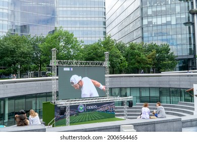 London, UK - July 7 2021: People Watching Sports On A Public Screen, South Bank London