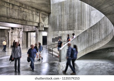 LONDON, UK - JULY 8, 2016: People Visit Brutalist Interior Of Tate Modern Gallery In London, UK. The Gallery Is Located In The Bankside Area Of The London Borough Of Southwark.