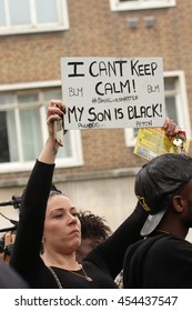 LONDON, UK - JULY 9 2016: A Protestor Holds Up A Placard Outside Brixton Police Station In A Solidarity March Following The Shooting Of Alton Sterling And Philando Castile By Poilice In The USA.