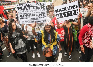 LONDON, UK - JULY 9 2016: Protestors March Towards Brixton Police Station Following The Shooting Of Alton Sterling And Philando Castile By Poilice In The USA. 