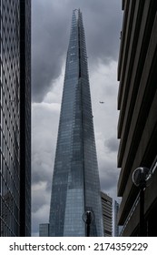 London, UK - Jun 09 2022: View Of The Shard Between Houses With A Plane In The Distance, Nicest Streets Of London Wallpaper