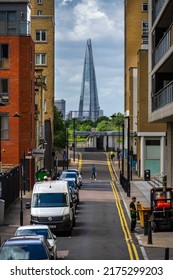 London, UK - Jun 10 2022: View Of Cuba Street With The Shard In The Background At Canary Wharf, Showing Everyday Life; Most Unique Streets In The World Wallpaper