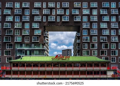 London, UK - Jun 10 2022: Unique Residential Building With Asian Restaurant In Front At Baltimore Wharf In Daylight, Canary Wharf, London; London Modern Architecture Wallpaper 