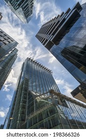 LONDON, UK - JUNE 08, 2014: Upward View Of  Modern Skyscrapers In The City Of London, The Heart Of Financial District In London. Over 300,000 People Work There, Mainly In The Financial Services Sector