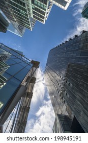 LONDON, UK - JUNE 08, 2014: Upward View Of  Modern Skyscrapers In The City Of London, The Heart Of Financial District In London. Over 300,000 People Work There, Mainly In The Financial Services Sector