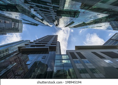 LONDON, UK - JUNE 08, 2014: Upward View Of  Modern Skyscrapers In The City Of London, The Heart Of Financial District In London. Over 300,000 People Work There, Mainly In The Financial Services Sector