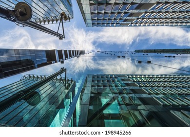 LONDON, UK - JUNE 08, 2014: Upward View Of  Modern Skyscrapers In The City Of London, The Heart Of Financial District In London. Over 300,000 People Work There, Mainly In The Financial Services Sector