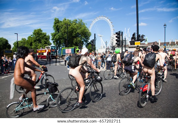 London, UK - June 10 2017: Unidentified participants\
cross Westminster bridge during the World Naked Bike Ride 2017,\
London, UK