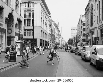 LONDON, UK - JUNE 12, 2015: Tourists In Busy Central London Street In Black And White