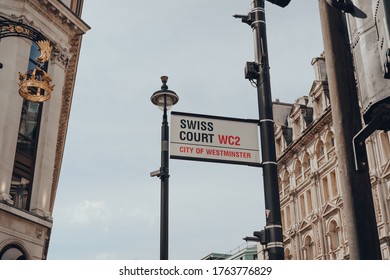 London, UK - June 13, 2020: Street Name Sign On Swiss Court In Soho, An Area Of London Famous For Its Shops, And Restaurants, On A Sunny Summer Day.