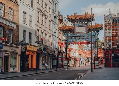 London, UK - June 13, 2020: Ornamental Gate With Qing Dynasty Designs On Empty Street In Chinatown, A Typically Busy Area Of London Famous For Its Restaurants And Home To A Large East Asian Community.