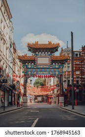 London, UK - June 13, 2020: Ornamental Gate With Qing Dynasty Designs On Empty Street In Chinatown, A Typically Busy Area Of London Famous For Its Restaurants And Home To A Large East Asian Community.