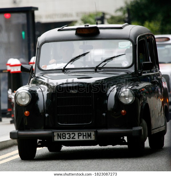 London, UK - June 14, 2012:\
TX4, London Taxi, also called hackney carriage, black cab.\
Traditionally Taxi cabs are all black in London but now produced in\
various colors.