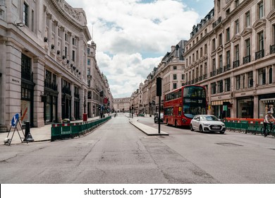 London, UK - June 14, 2020; Deserted Regents Street during lockdown in daytime. Double-decker bus is driving. The Coronavirus (COVID-19) pandemic has spread to many countries across the world.