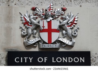 London, UK - June 2, 2022: City Of London Sign And Emblem Including Dragons And Shield Attached To A Wall. 