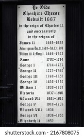 London, UK - June 2, 2022: A List Of The Reigns Of British Monarchs Since The Rebuilding Of Ye Olde Cheshire Cheese Pub In 1667 Displayed On A Sign Attached To The Wall, London, UK.