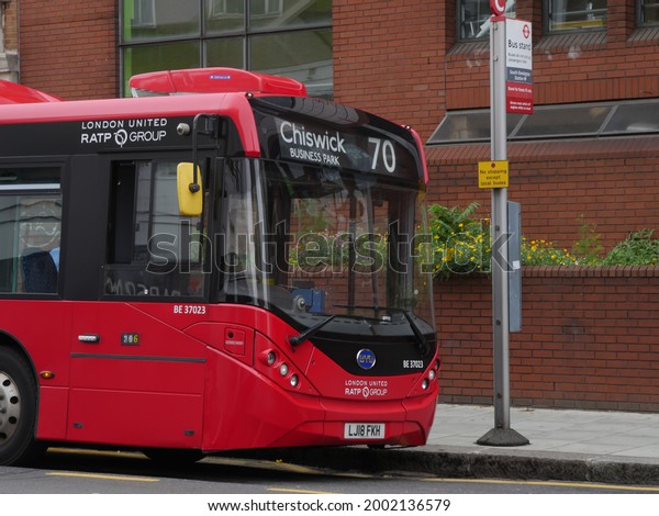 London, UK - June 20 2021: London United bus stopped\
at a bus stop