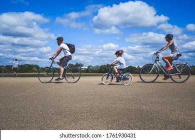 London, UK - June 2020 .A Young Family Cycle Together During Covid-19 Lockdown Near Hackney Marshes