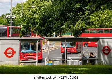 London, UK - June 2020 : People Commuting Waiting For The Buses Departing From The Crystal Palace Bus Station On A Busy London Street In Summer