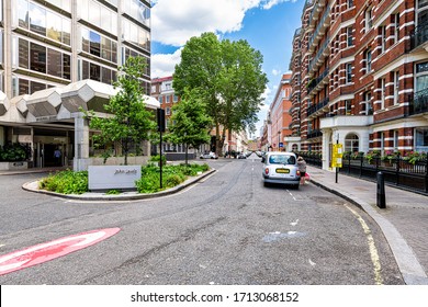 London, UK - June 21, 2018: Victoria downtown city road street with office sign for John Lewis head office headquarters and historic architecture
