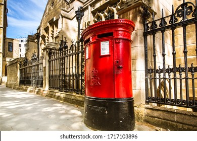 London, UK - June 21, 2018: View Of A Traditional Royal Mail Red Pillar Box Outside A Post Office.