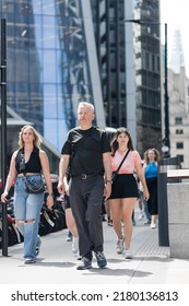London, UK - June 21, 2022: Group of people walking in the City of London. City of London financial and business area life, street photography