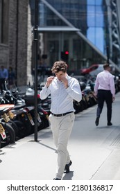 London, UK - June 21, 2022: Businessman is walking in the City of London street. City of London financial and business area life, street photography