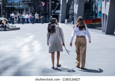 London, UK - June 21, 2022: Young women is walking in the City of London street. City of London financial and business area life, street photography