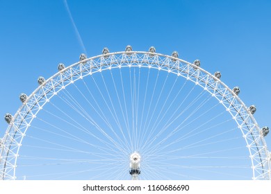 London, UK - June 22, 2018: Closeup View Of London Eye Center With Wires Isolated Against Blue Sky Ferris Wheel Spinning