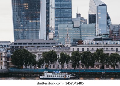 London, UK - June 22, 2019: The Wyndham Party Boat On River Thames By Modern Office Buildings Of The City Of London, London's Famous Financial District, During Blue Hour.