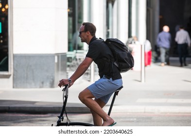 London, UK - June 22, 2022: Man Cycling At Work By Bike. People Cycling Into The City Of London