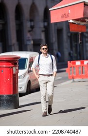 London, UK - June 22, 2022: Young Man Walking In Early Morning In The City. Busy Business Life Of The City. People Rush At Work  Street Photography